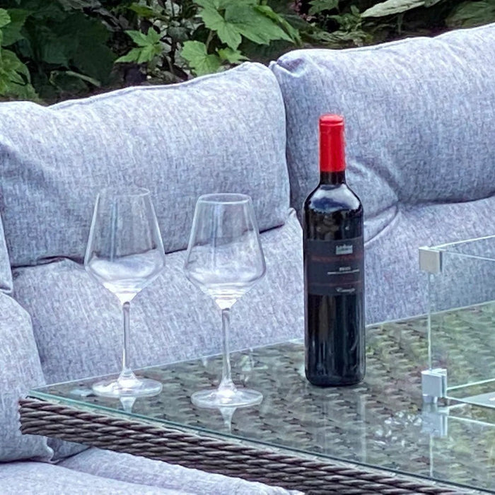 Mid Ulster Garden Centre Amalfi dark grey rattan dining set with wine bottle and glasses on glass firepit table