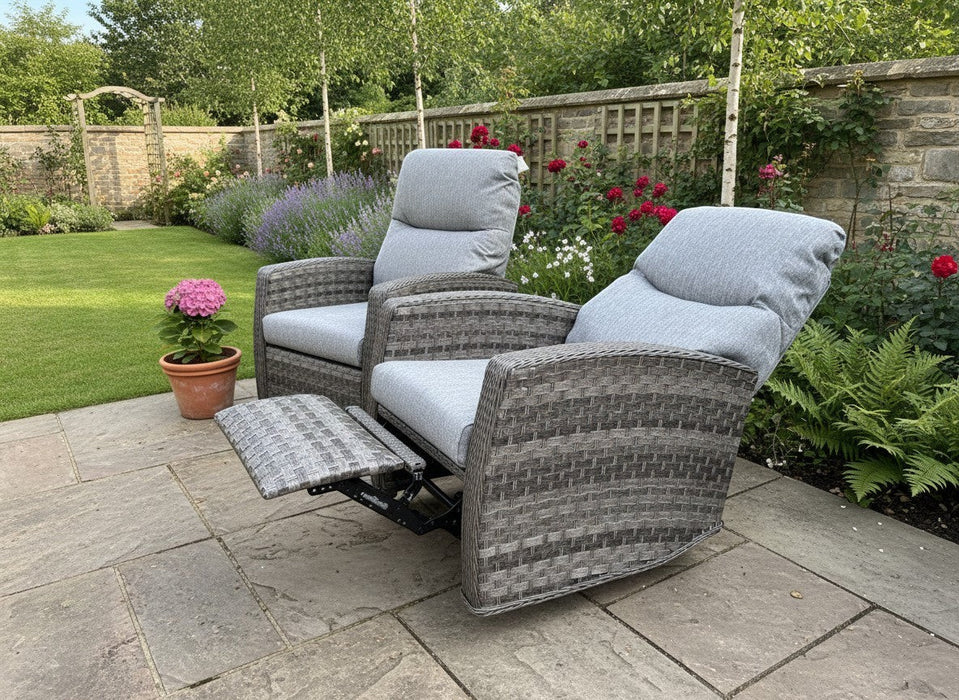 Mid Ulster Garden Centre Amalfi two-tone grey wicker recliner chairs with soft cushions on a stone patio.