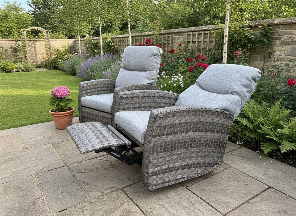 Mid Ulster Garden Centre Amalfi two-tone grey wicker recliner chairs with soft cushions on a stone patio.