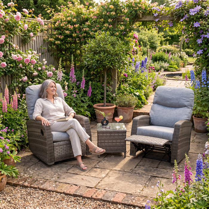 Mid Ulster Garden Centre Amalfi recliner bistro set with grey weave chairs and glass table in a lush garden setting.