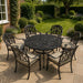Mid Ulster Garden Centre Bramblecrest Venice 6-seater bronze cast aluminium dining set on a stone patio.