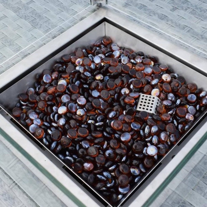 Mid Ulster Garden Centre Amalfi firepit table center with dark amber glass stones and protective glass surround