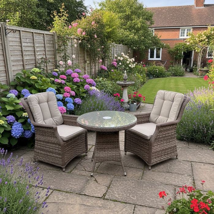 Mid Ulster Garden Centre Hampton 2 seat bistro set with light brown synthetic rattan chairs and glass top table in garden