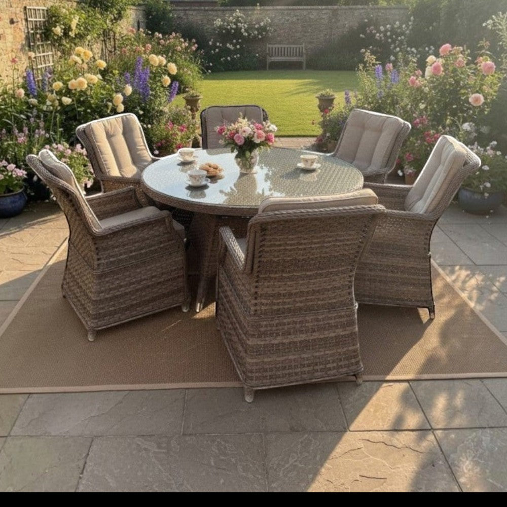 Mid Ulster Garden Centre Hampton 6 seat round rattan dining set with beige cushions in a lush flower garden