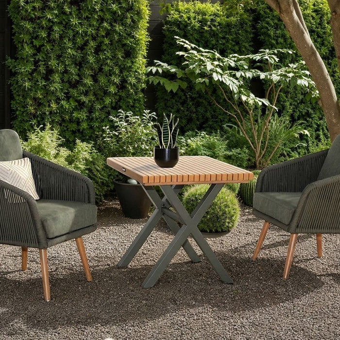 Mid Ulster Garden Centre Hartman Eden bistro set with juniper green rope chairs and a teak-effect table in a garden.