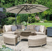 Mid Ulster Garden Centre Kettler Palma round wicker sofa set in oyster with stone cushions and a large garden parasol.
