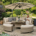 Mid Ulster Garden Centre Kettler Palma round wicker sofa set in oyster with stone cushions and parasol on a patio