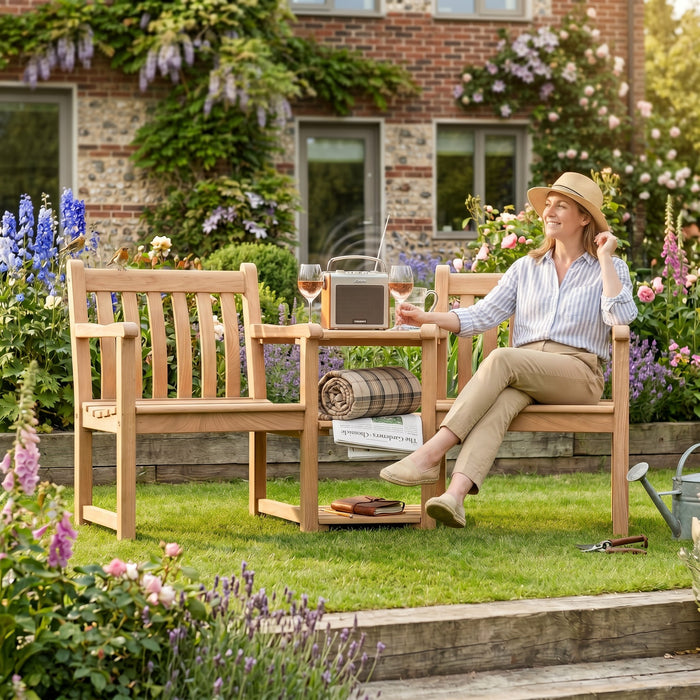 Mid Ulster Garden Centre Alexander Rose Roble companion set with a woman relaxing in a lush garden setting.